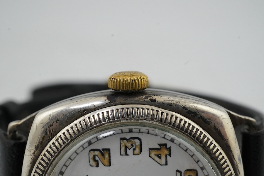 A George V silver military? manual wind wrist watch, case import marked for London, 1915, and a silver J.W. Benson manual wind wrist watch. Condition - poor to fair